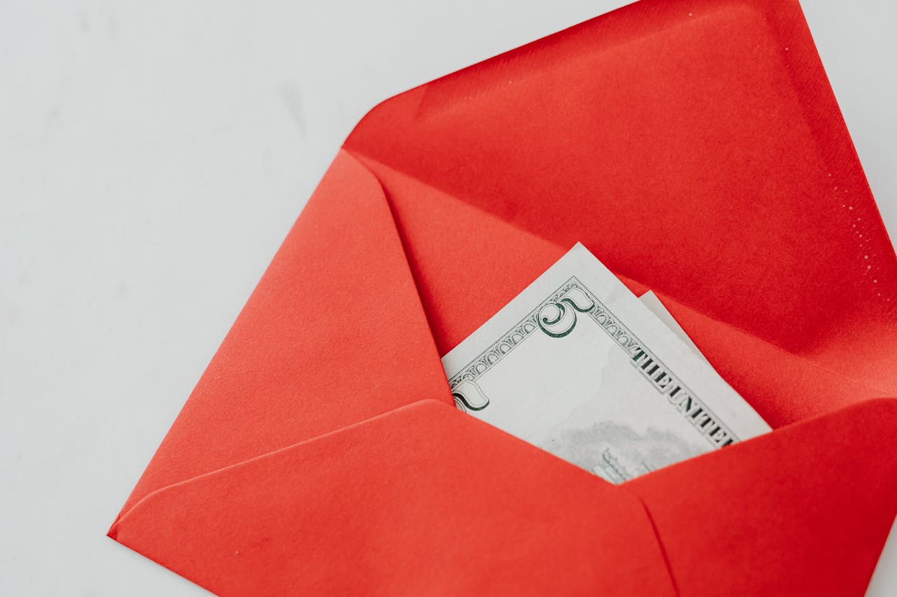 Five Dollar Note in a Red Envelope, Blurred Background