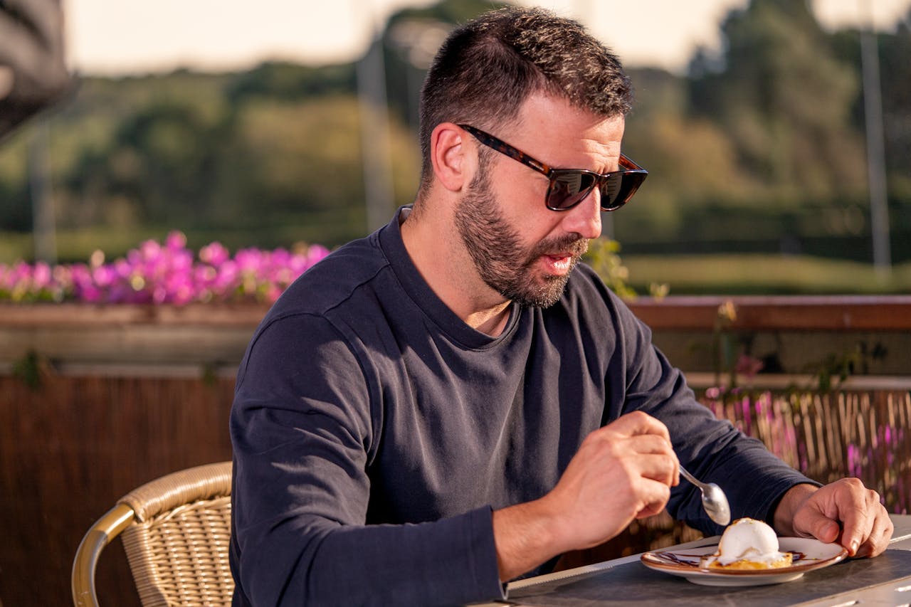 Portrait Photo of A Man in dark blue outfit Dining Outdoors