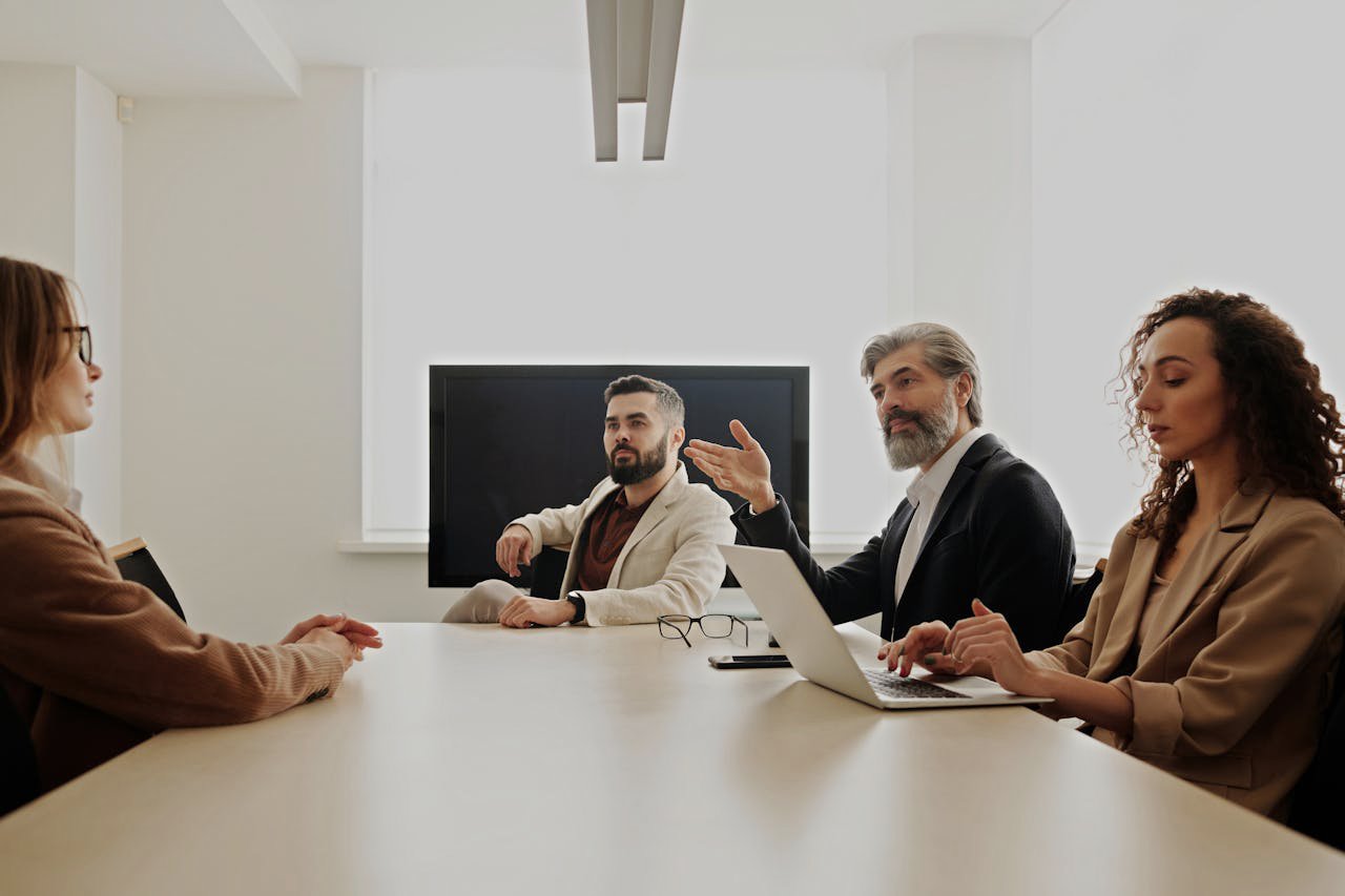A Group of People Sitting at the Table