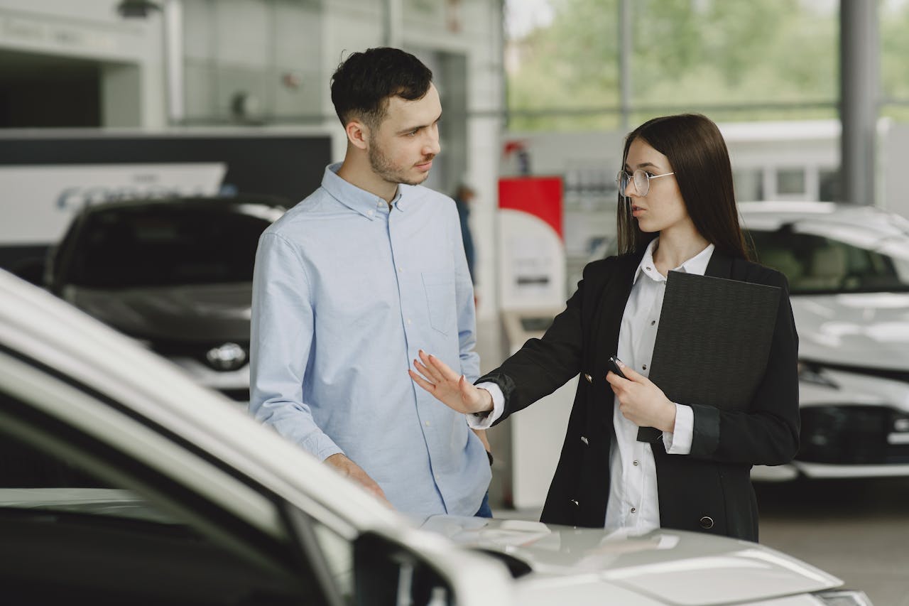Woman Selling Car to Client