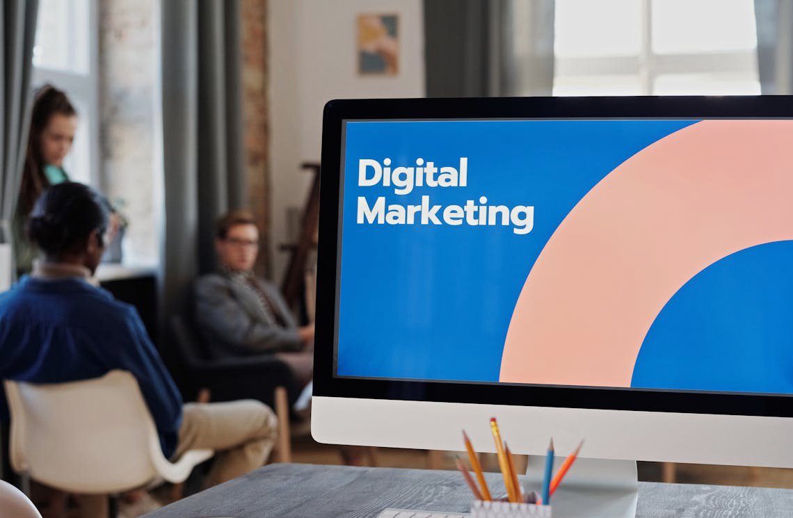 Silver Imac on Brown Wooden Table