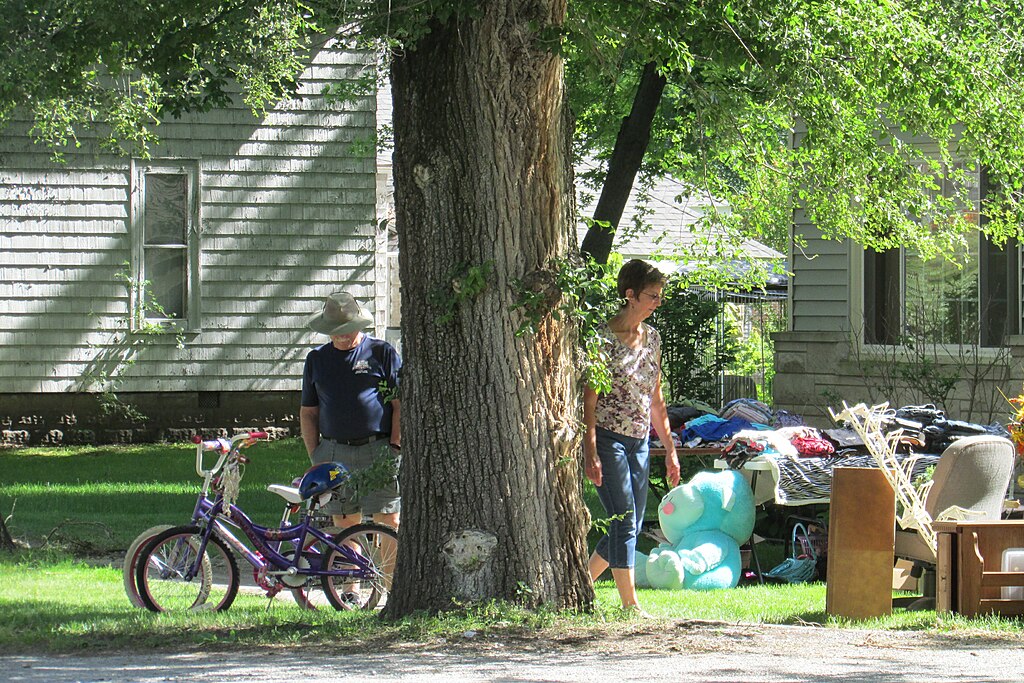 Photo of a quiet garage sale in a shaded yard