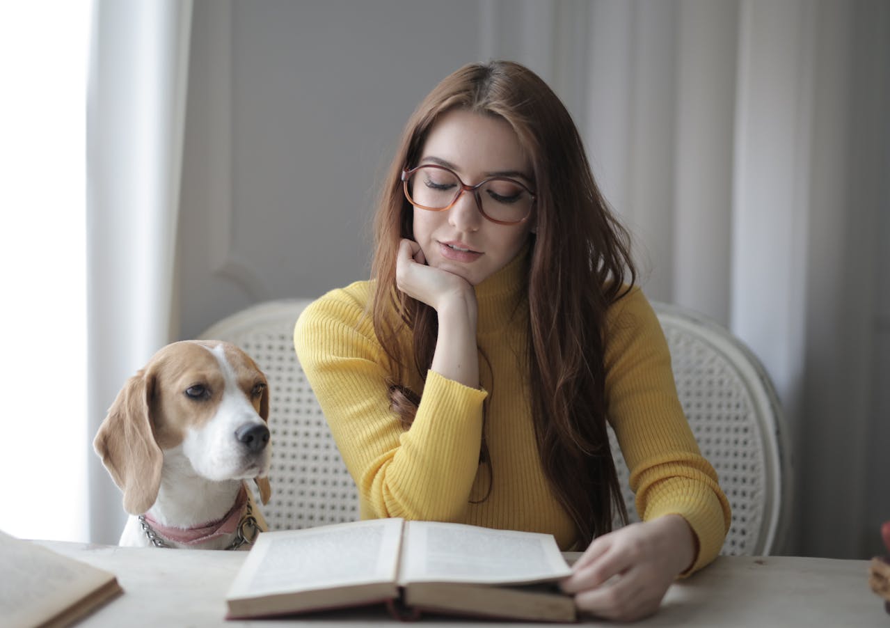 Portrait Photo of a Woman in Yellow Sweater and a dog