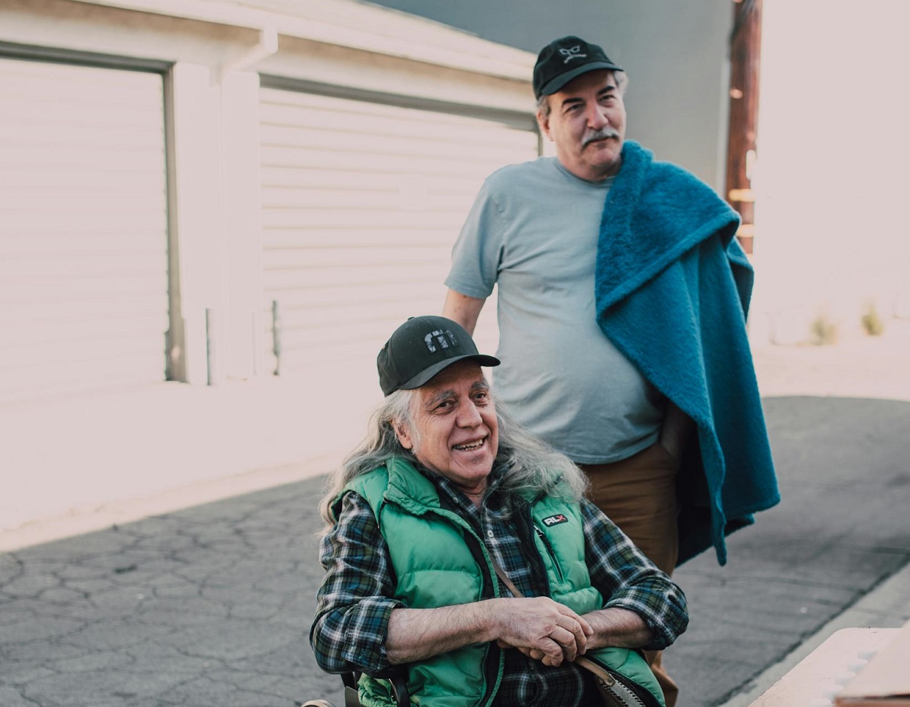 Two senior man outside.