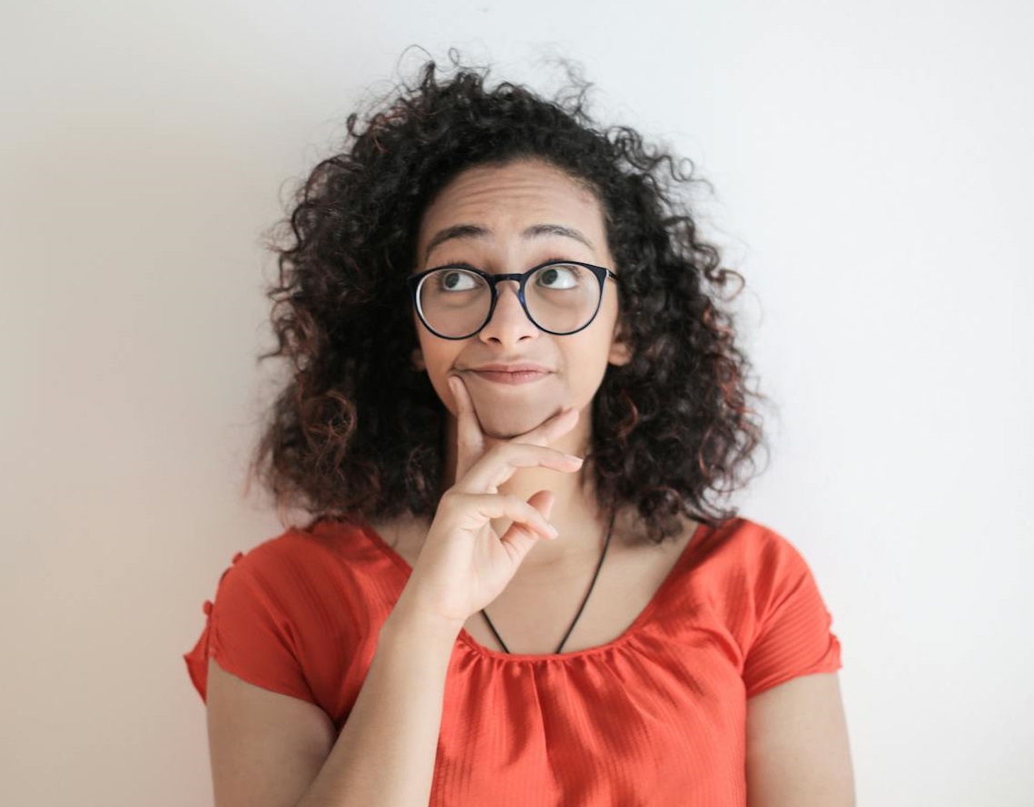 Woman Thinking and looking up.