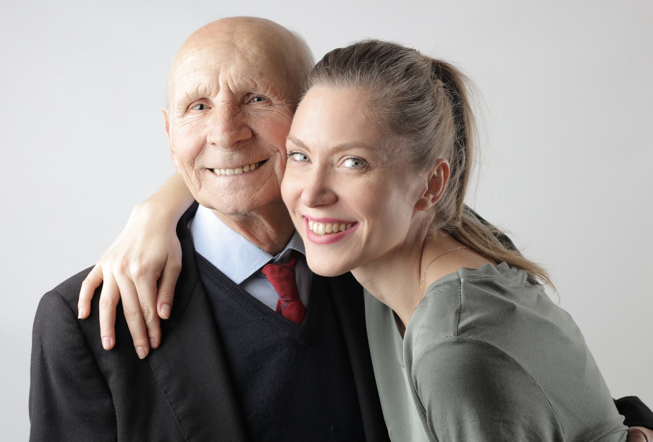 Portrait Photo of Delighted senior father and adult daughter