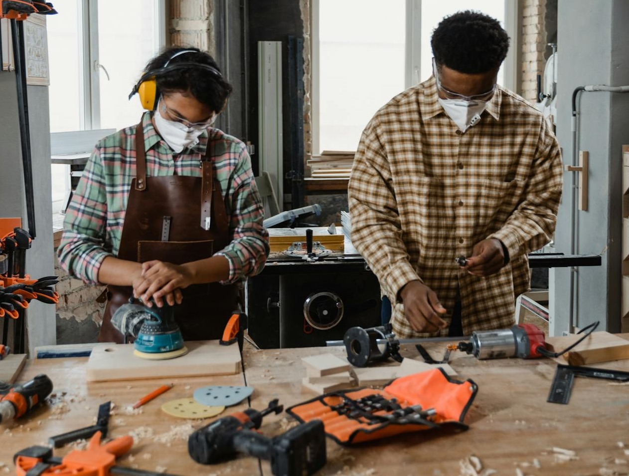 A Man and Woman Doing Carpentry