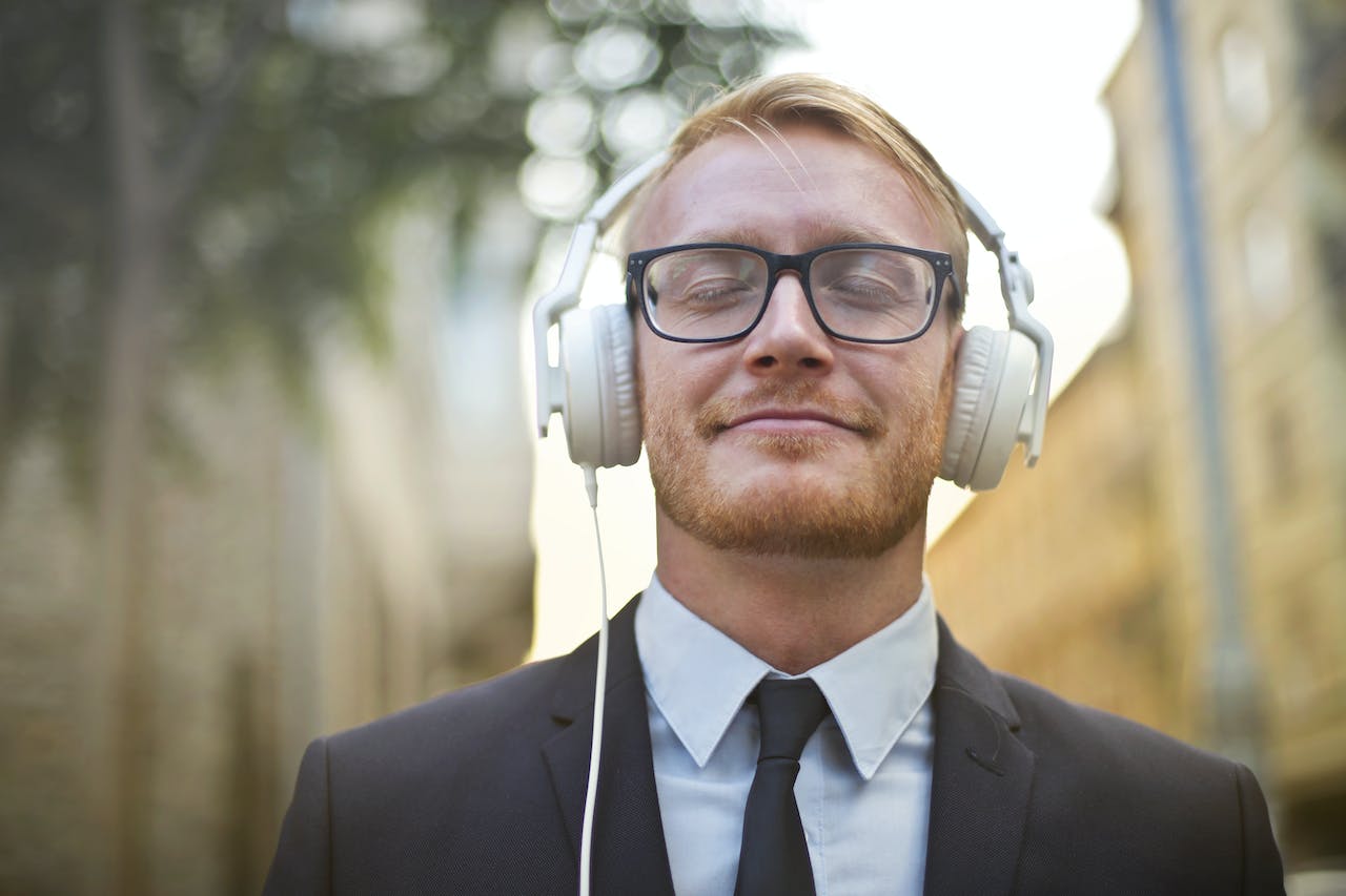 Man listening music on headphones.
