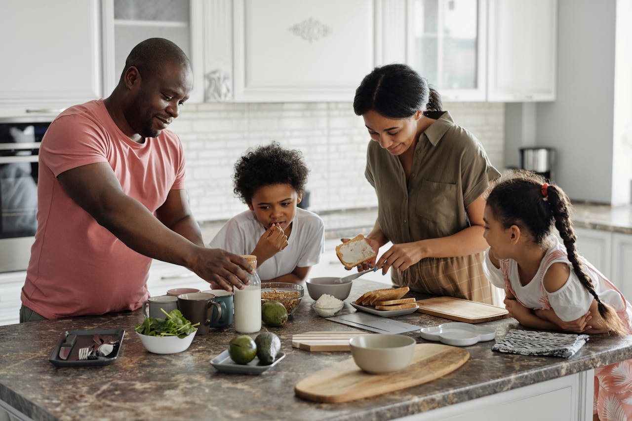 Family is making a breakfast in the kitchen.
