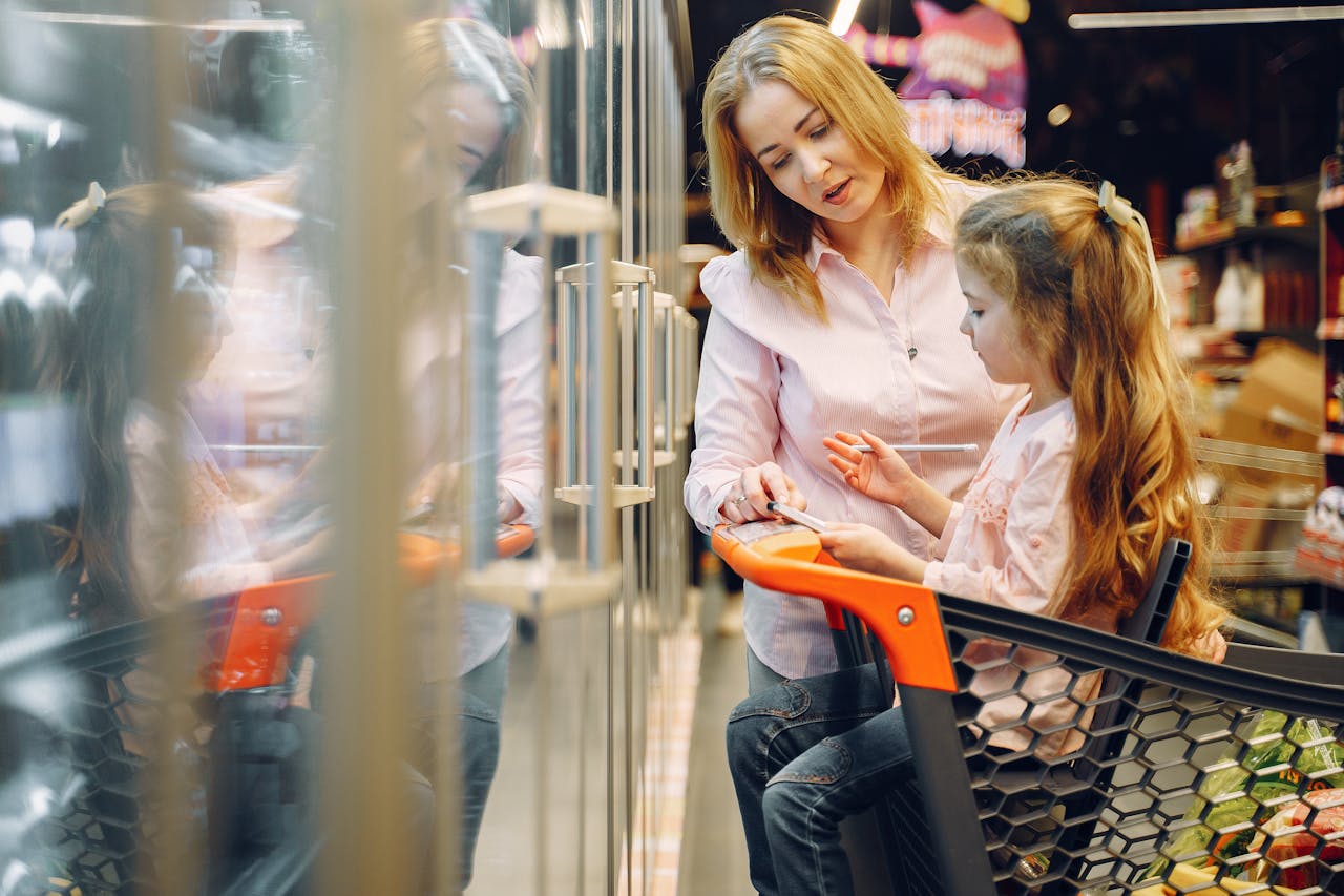 Mother and daughter checking their grocery list.