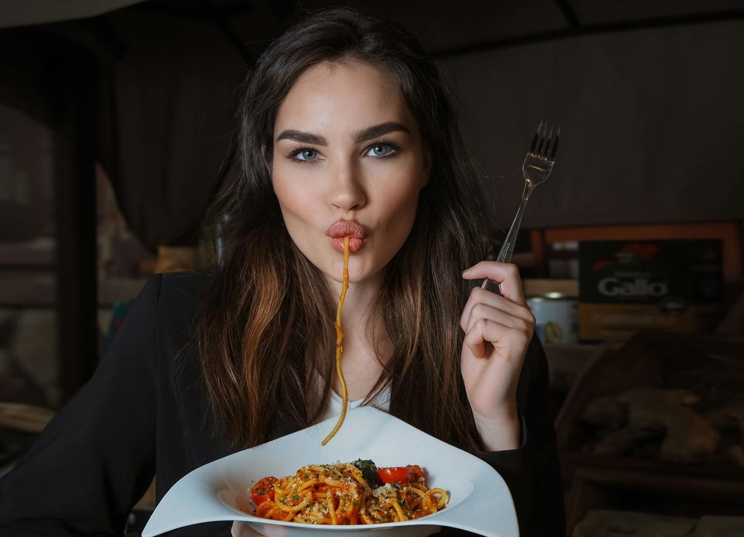 Woman eating spaghetti.