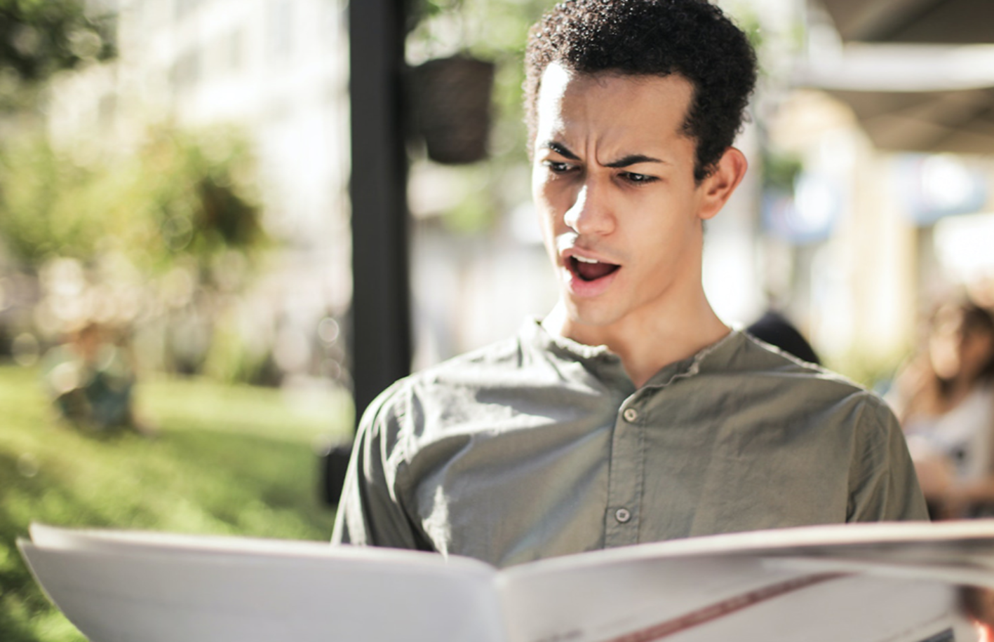 Shocked Man Reading A Newspaper