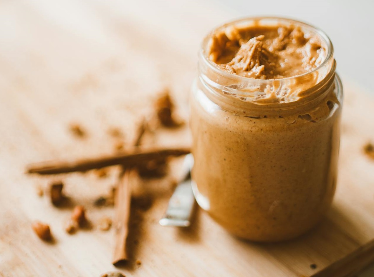 Jar with Peanut Butter on Table