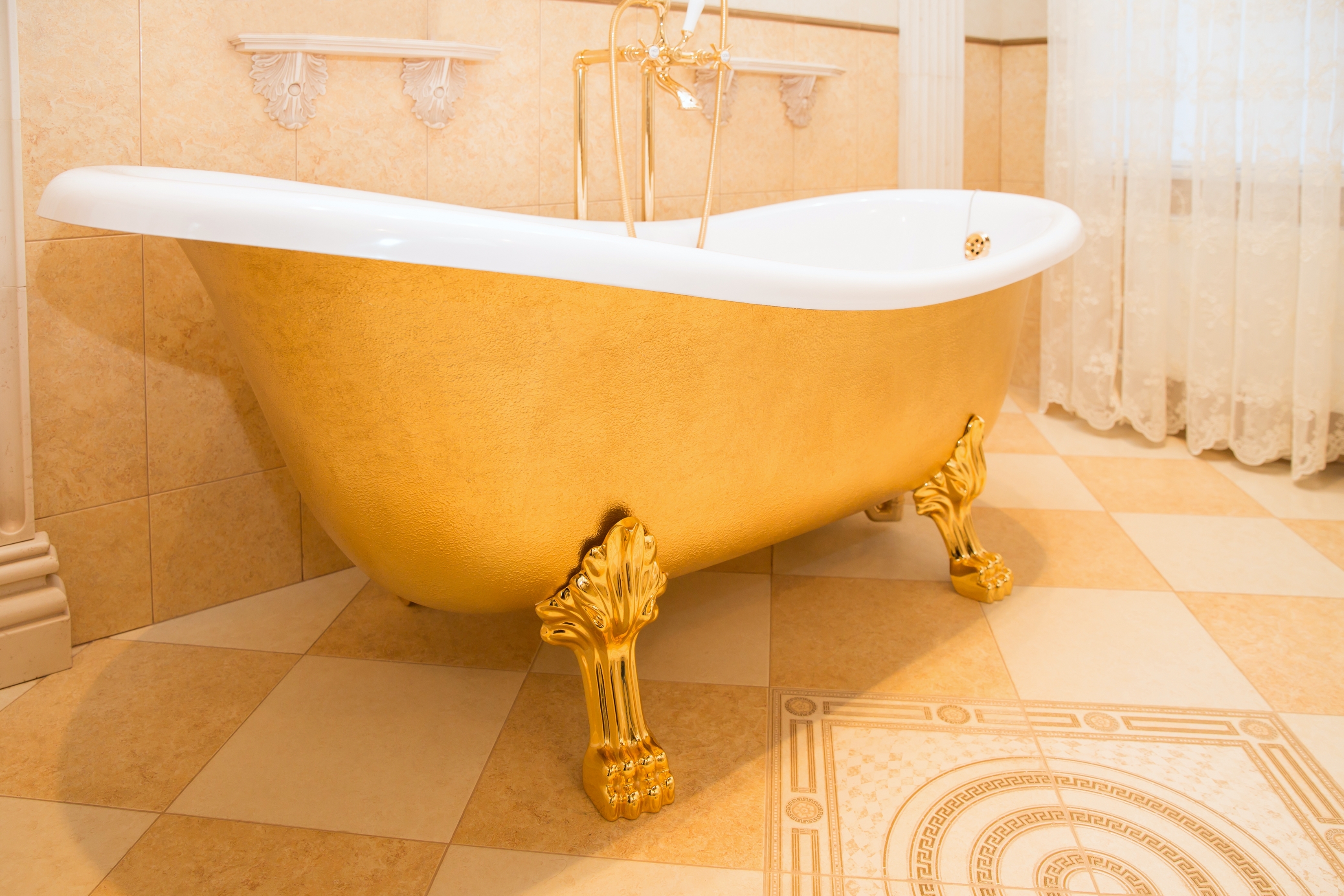 Retro golden bathtub in vintage bathroom