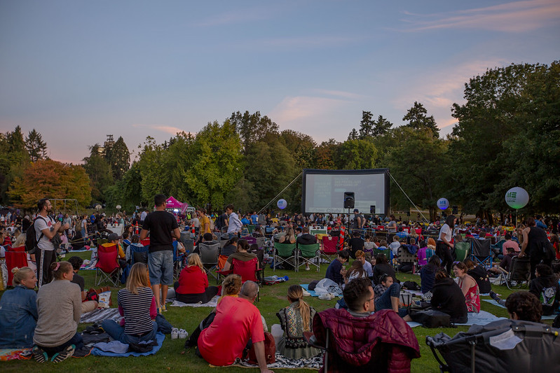 People sitting on the grass at the Evo Summer Cinema, FREE Outdoor Movie 2019 Second Beach