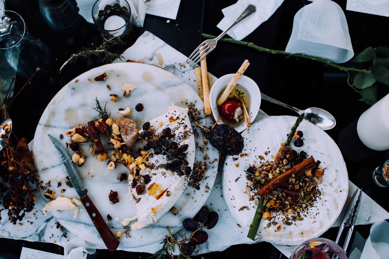 Close-up Photo of white Plates with leftover food on table