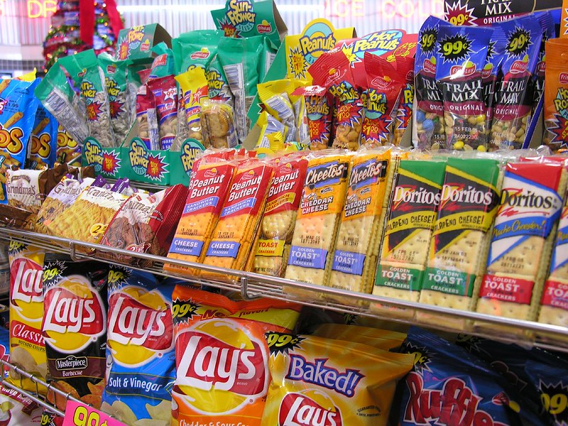 Close-up Photo of Colorful snacks displayed on a store rack