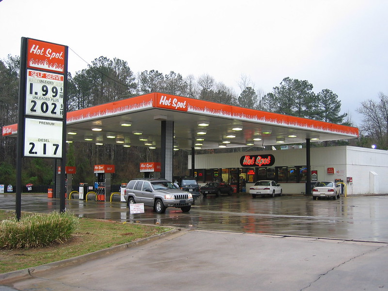 Photo of a Gas Station on with a price sign in front