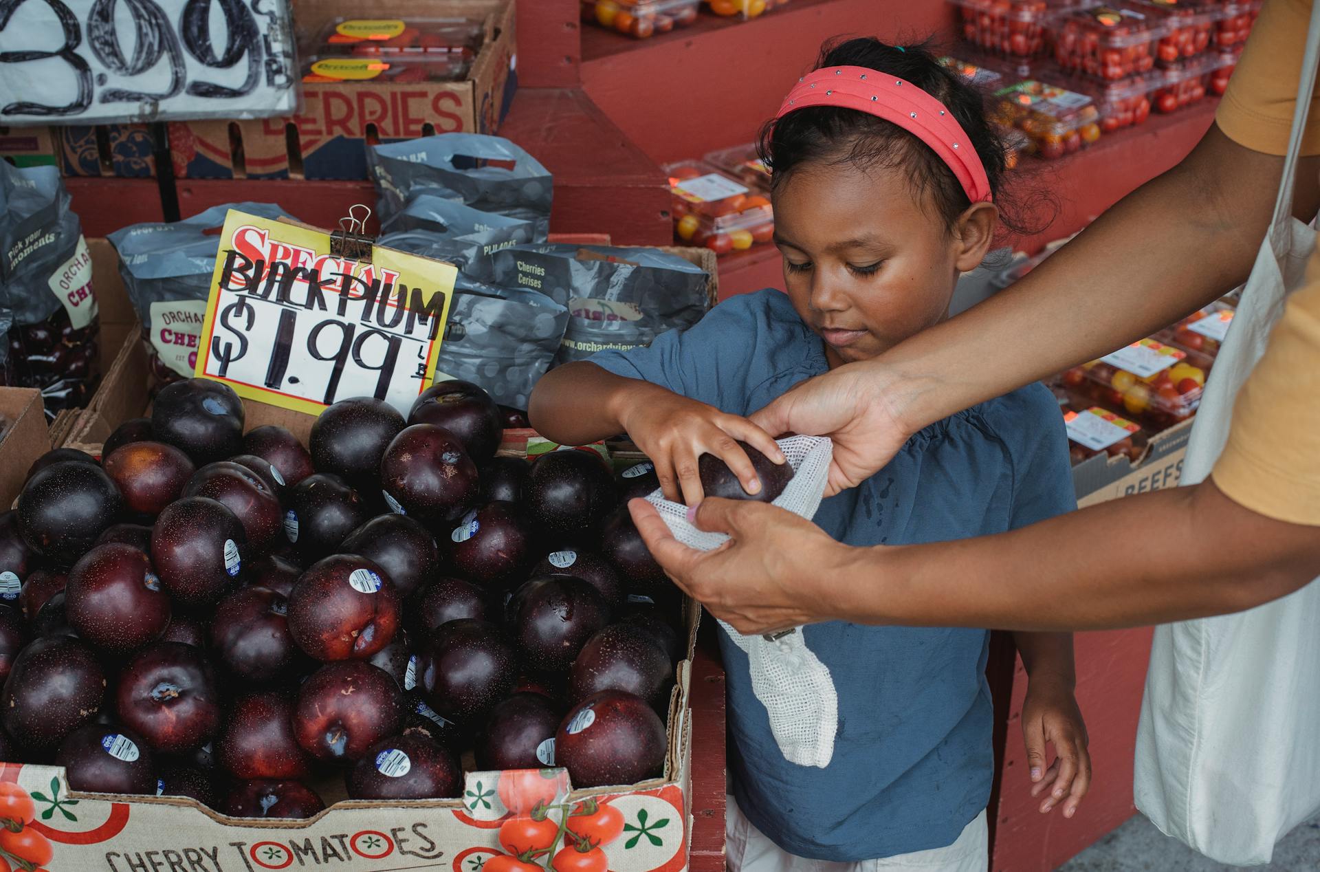 Kids buying fruit from street market