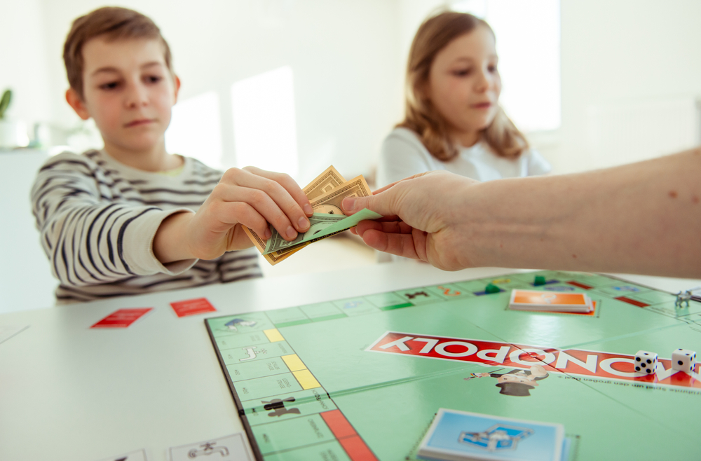 Kids playing Monopoly