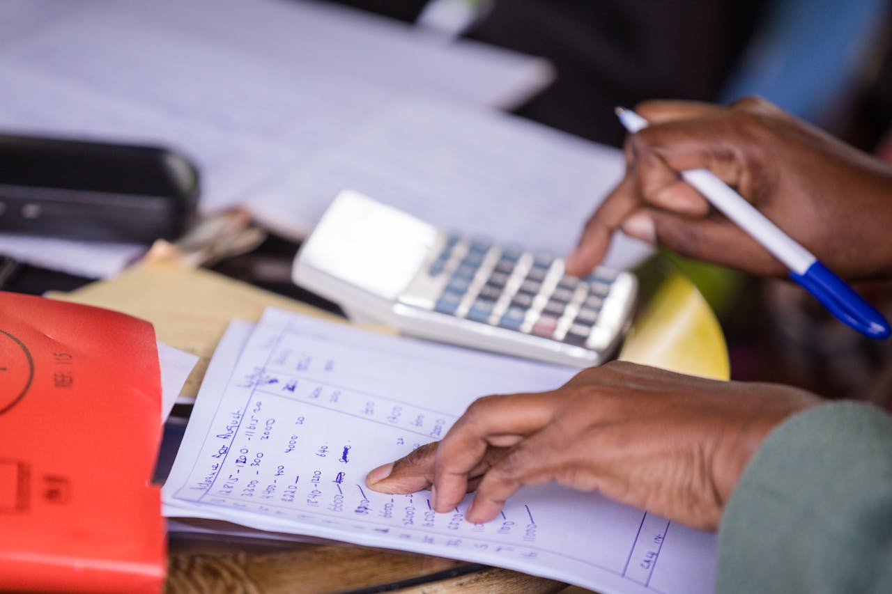 Photo of a Accountant Table with a Calculator