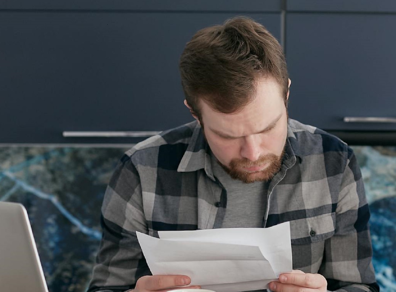 Man Looking at Documents
