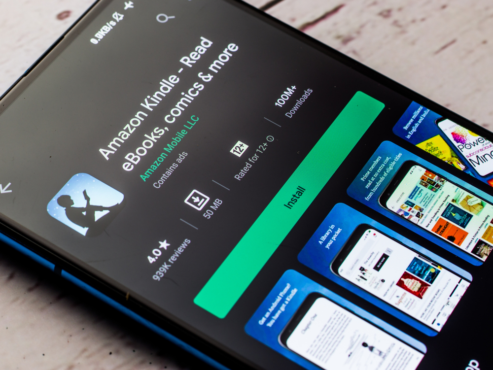 phone with open Kindle app, online reading platform.