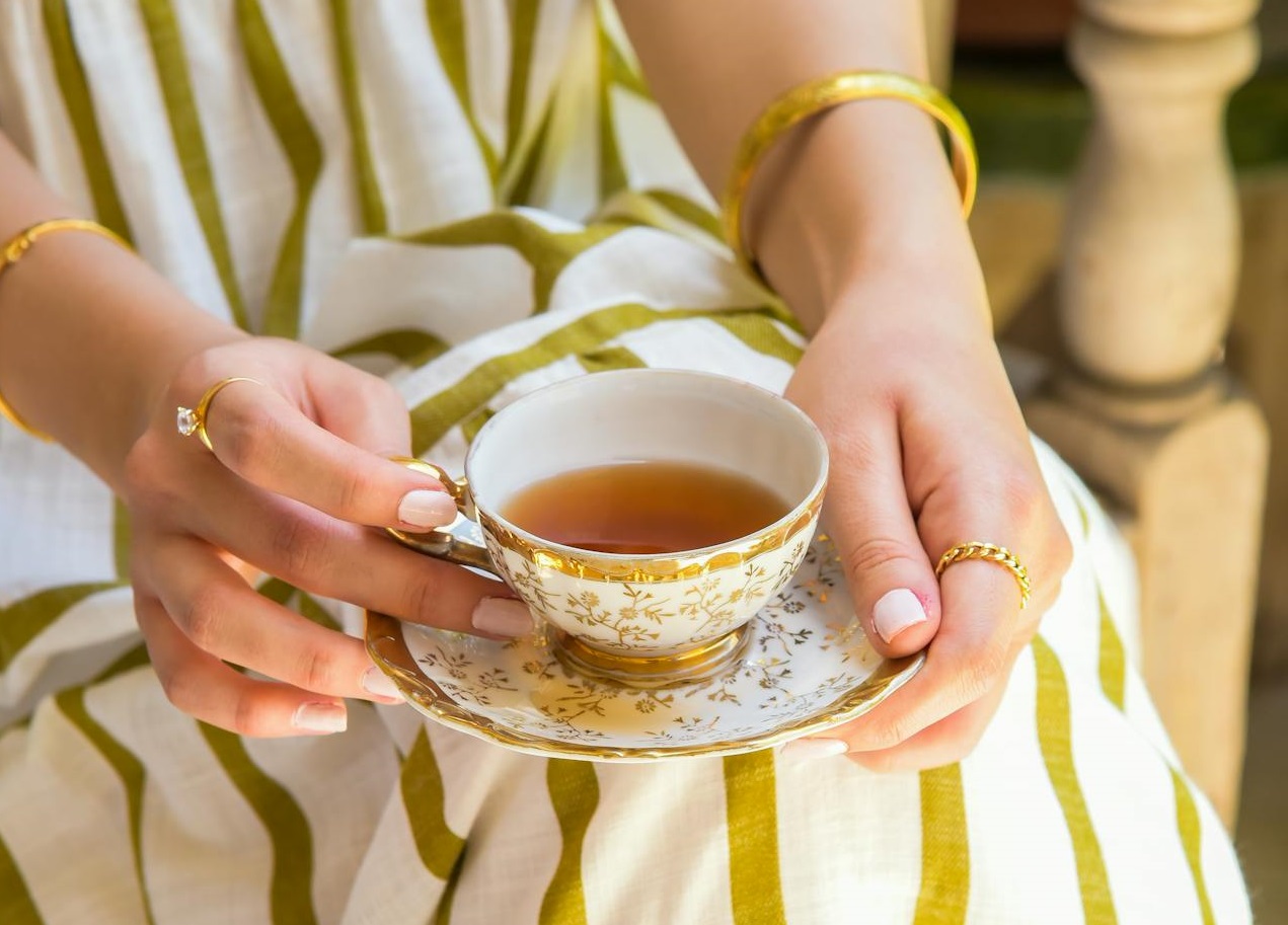 Person Holding Ceramic Teacup