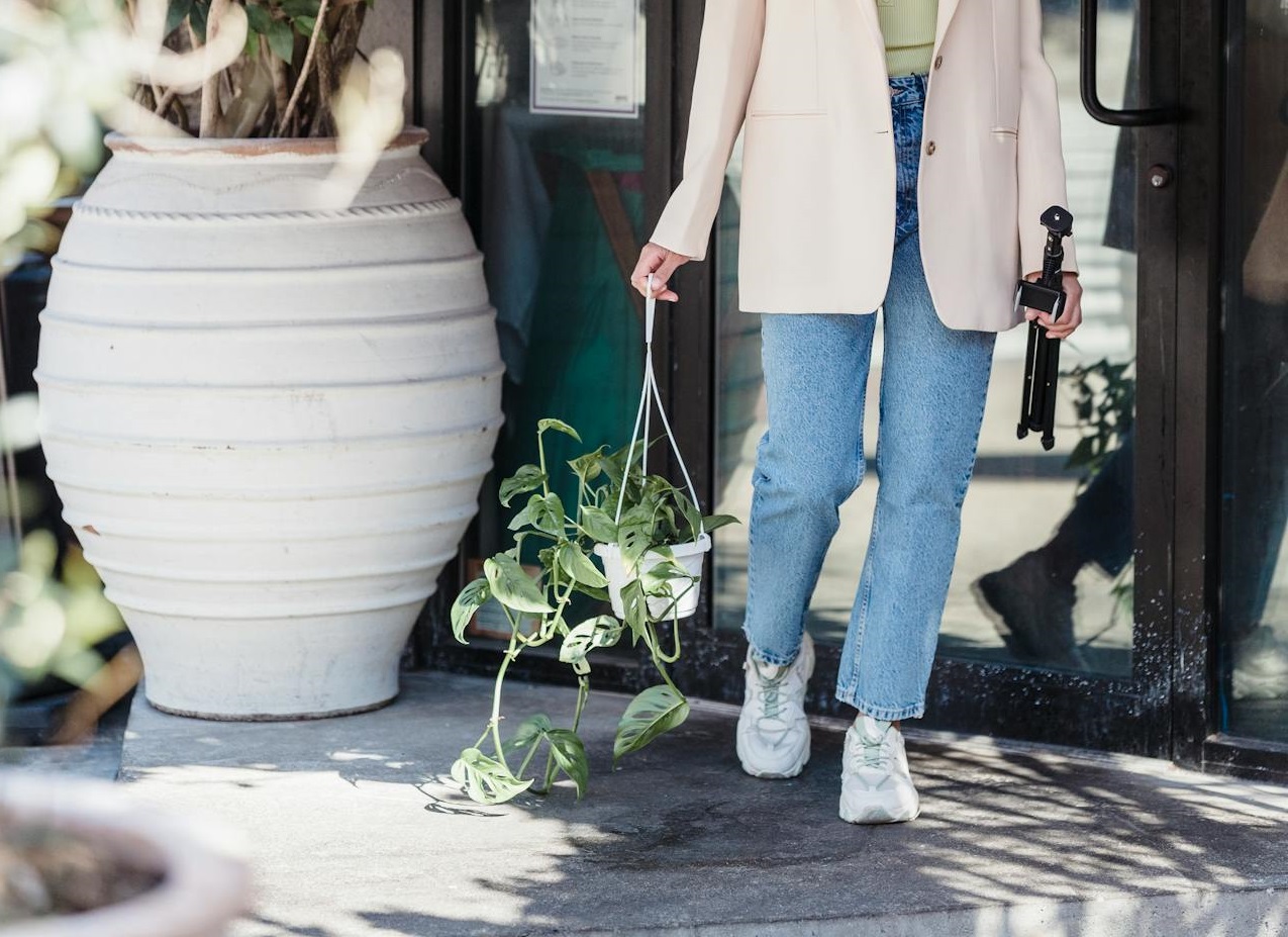 Woman buying a plant.