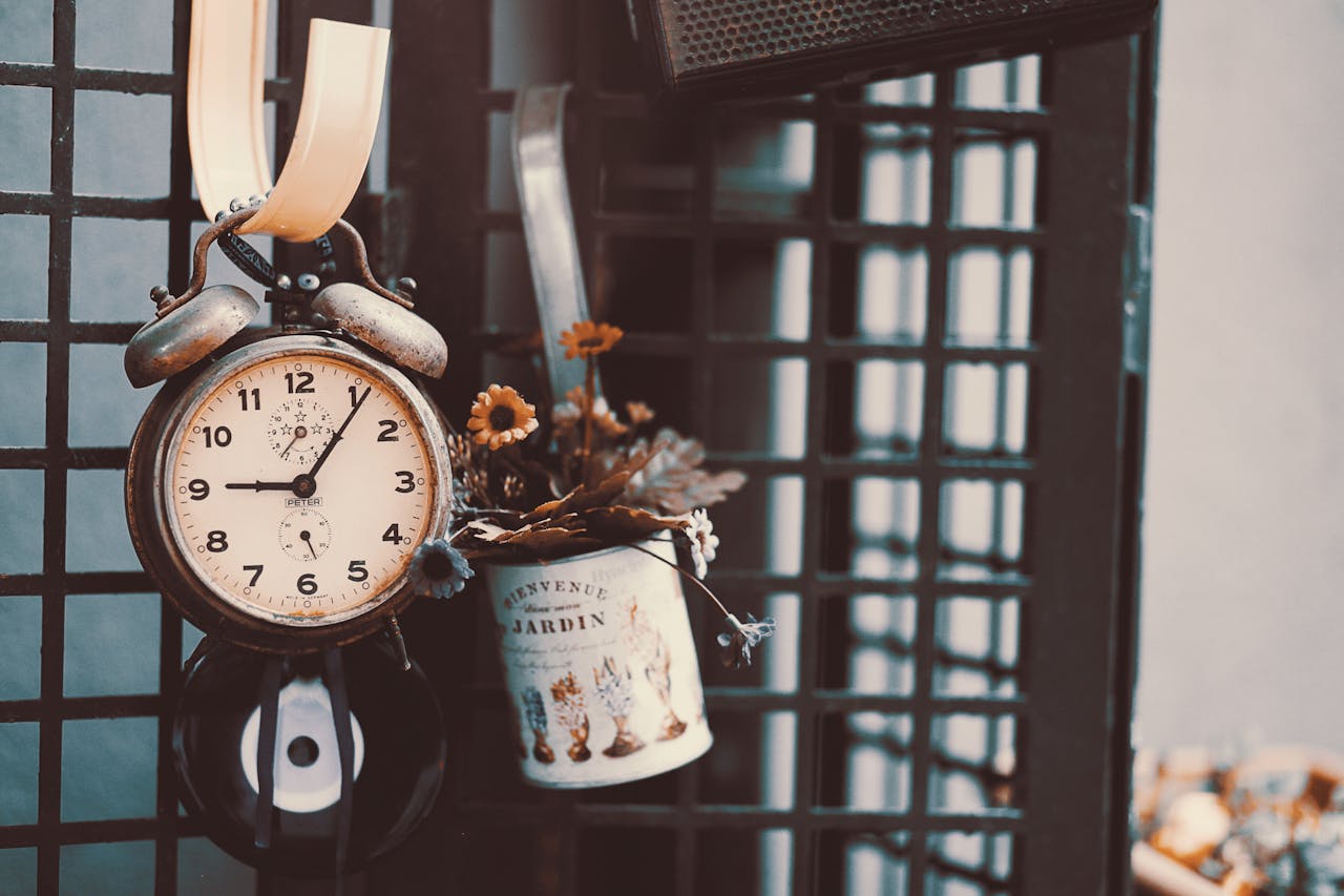 Close-up of vintage Clock and flowers.