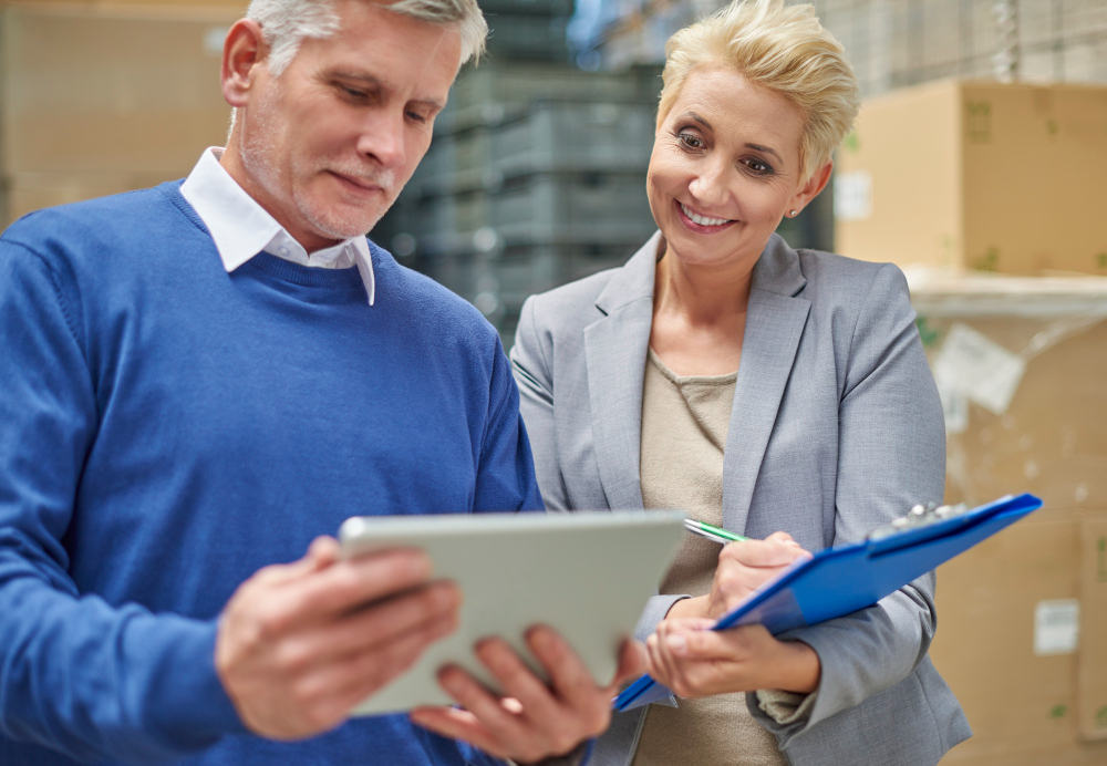 Two people working in warehouse