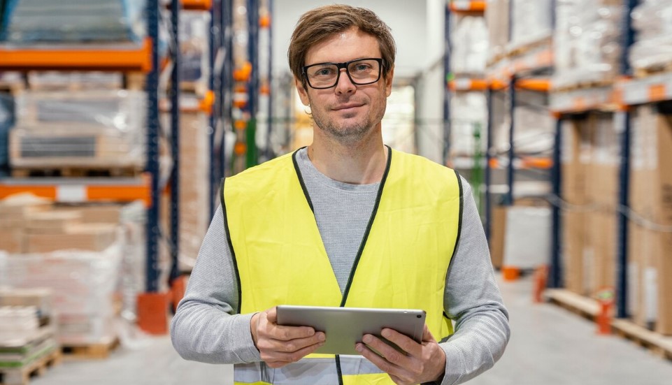 Man with tablet working logistic