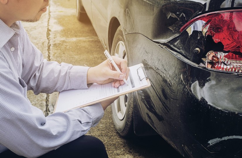 Insurance agent working on car accident