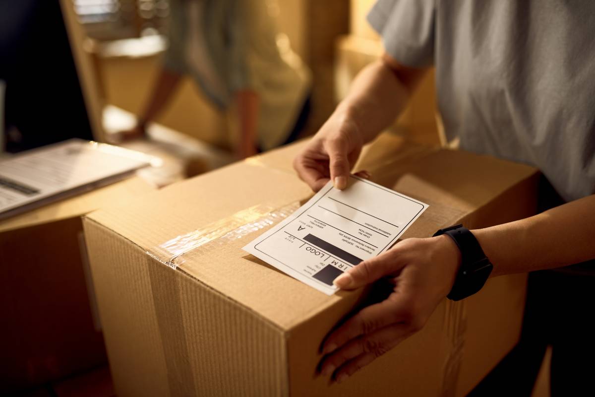 image of a man getting ready a package