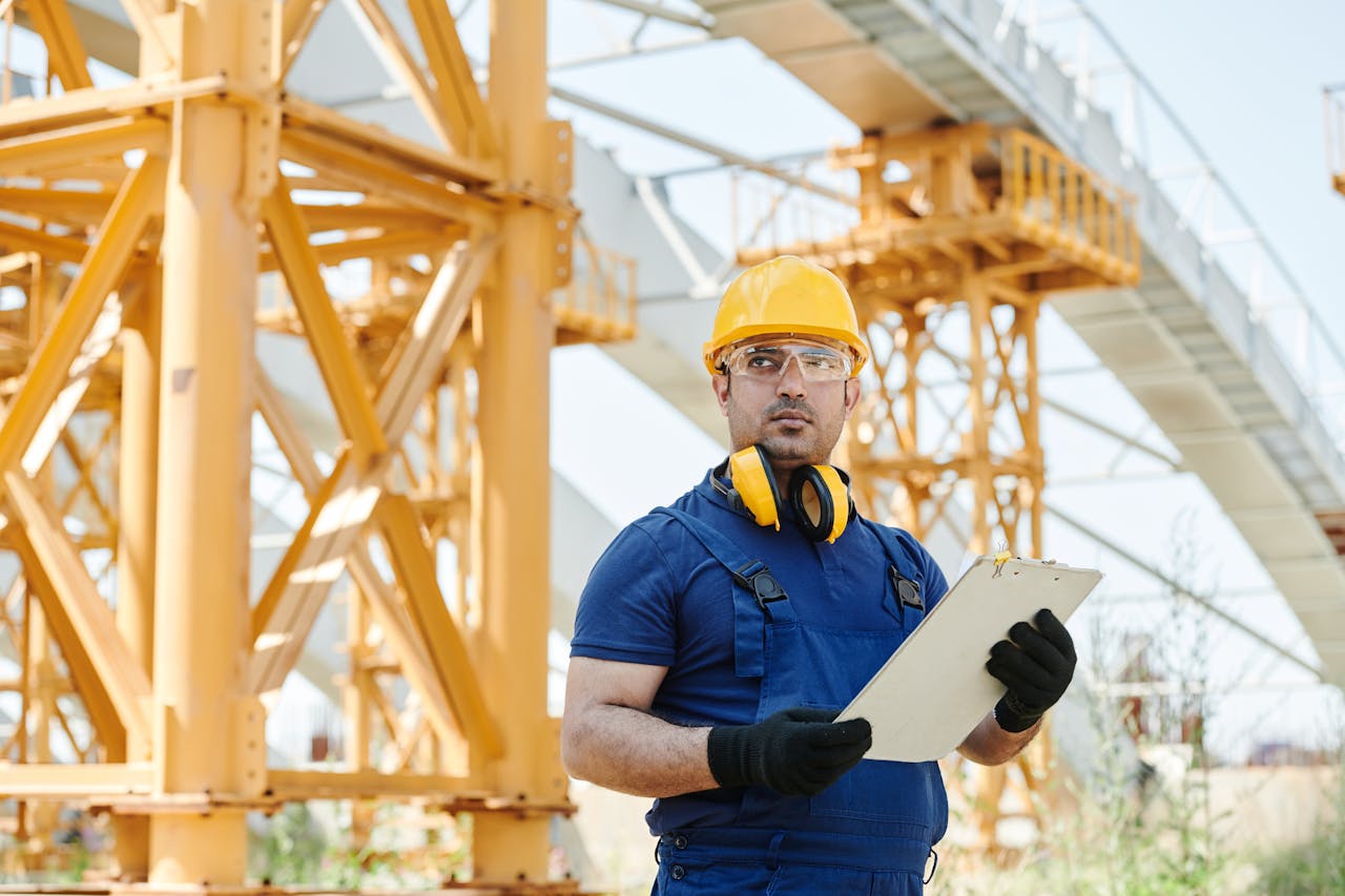 Man in Blue Shirt at a construction site