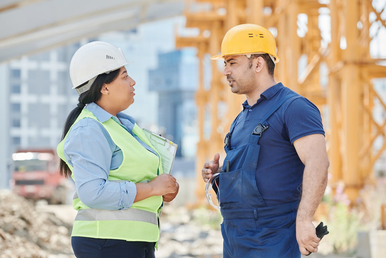 A Man and a Woman Working at a Construction Site