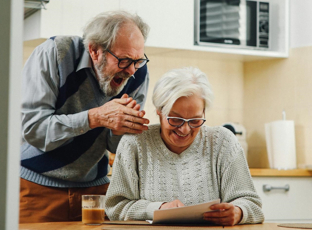 Happy couple looking at documents