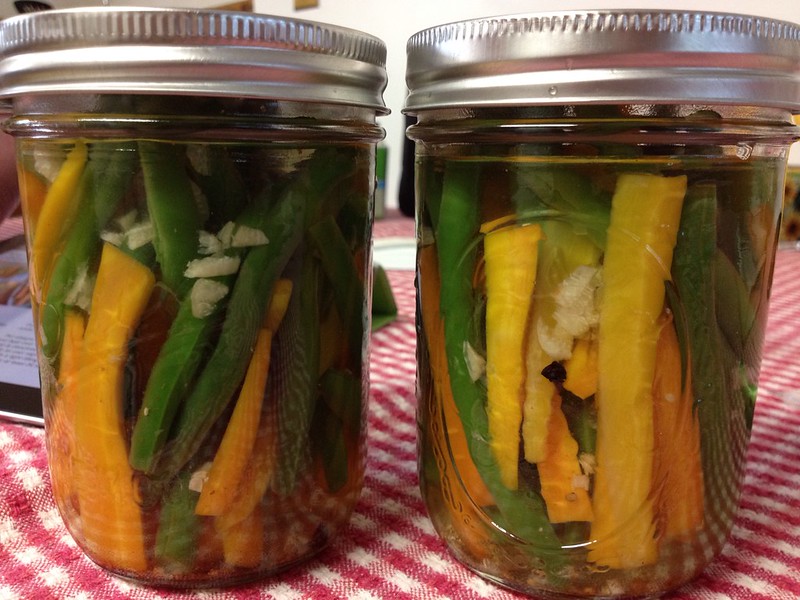 Close Up Photo of Two Jars with Preserved Vegetables placed on a table