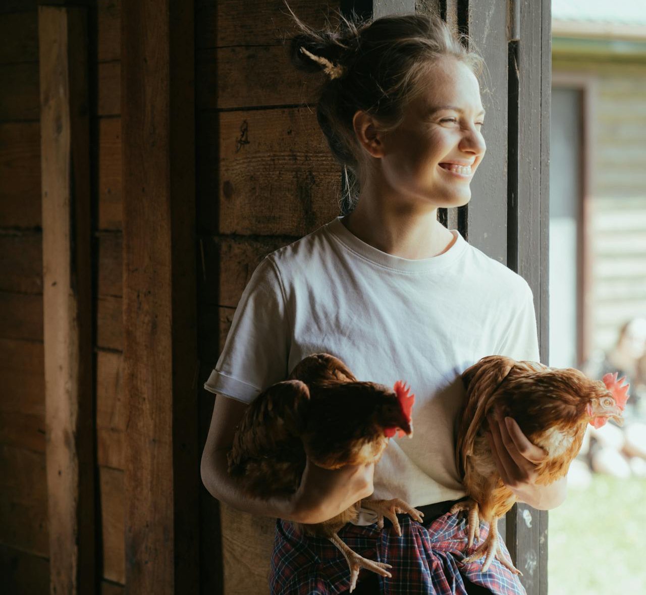 Girl in White Crew Neck Shirt Standing Beside wooden Door