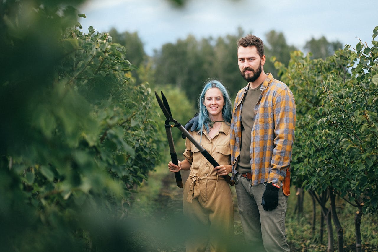 A Woman Holding Shears while Standing beside a Man