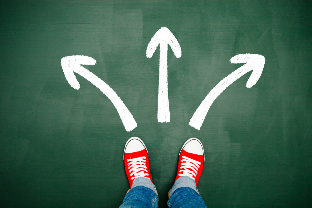 man choosing a way marked with arrows