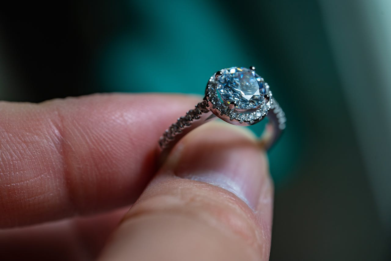 Person Holding a Diamond Ring