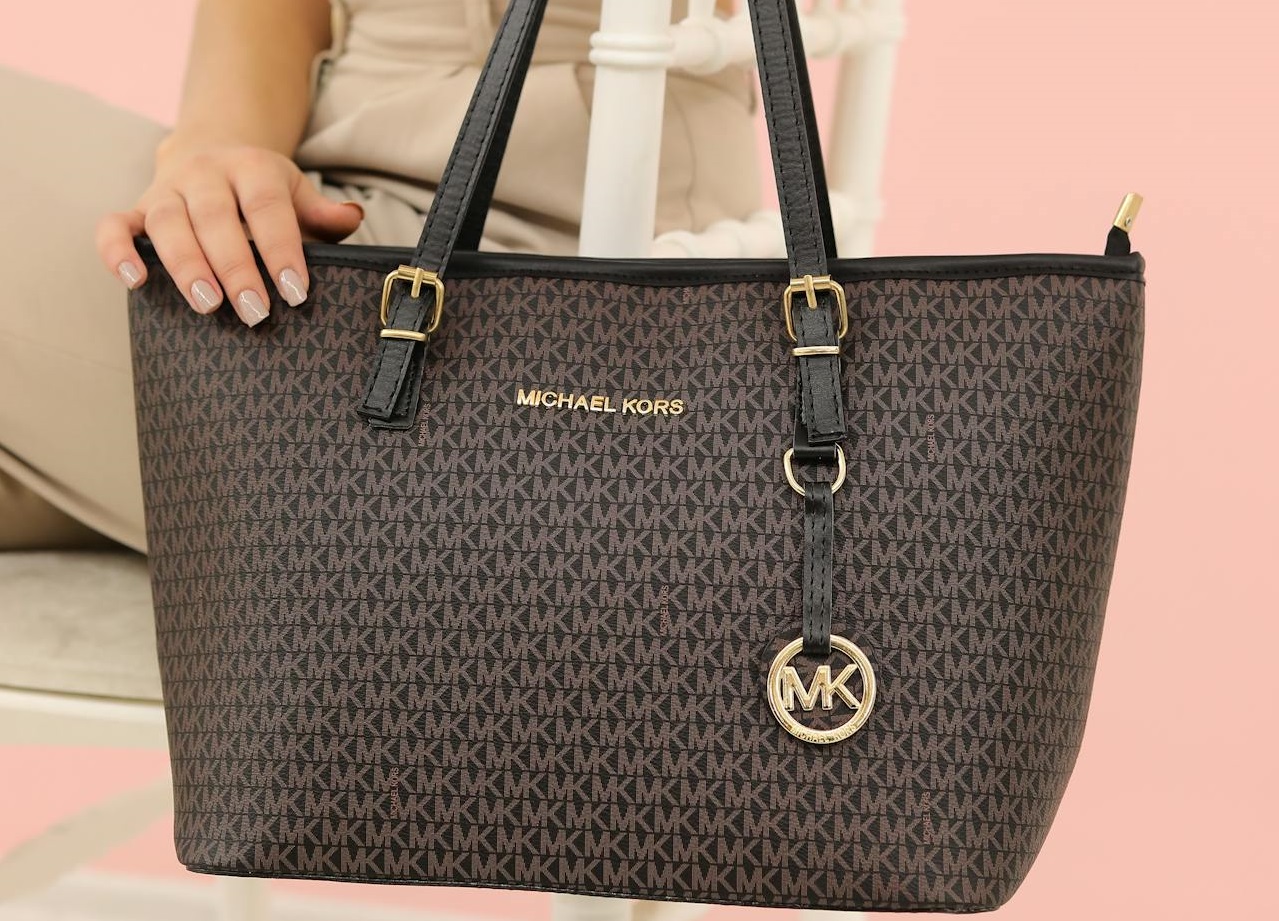 Woman Sitting with brown Bag.