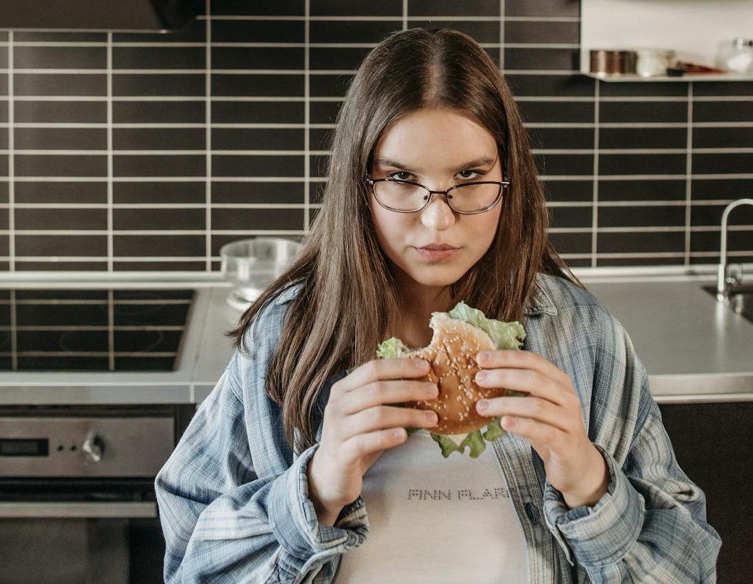 Woman Eating A Delicious Sandwich