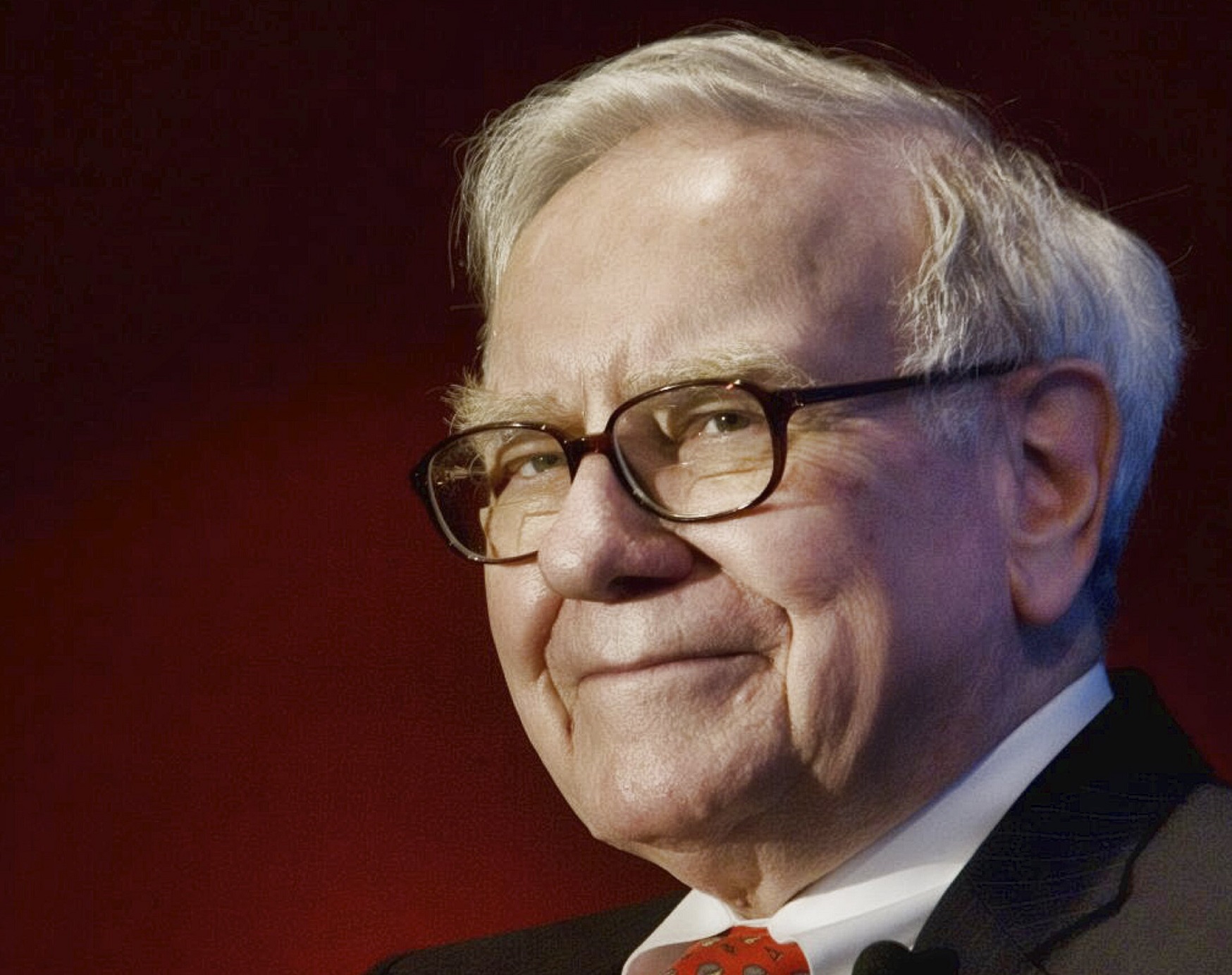 Warren Buffett looking at side.