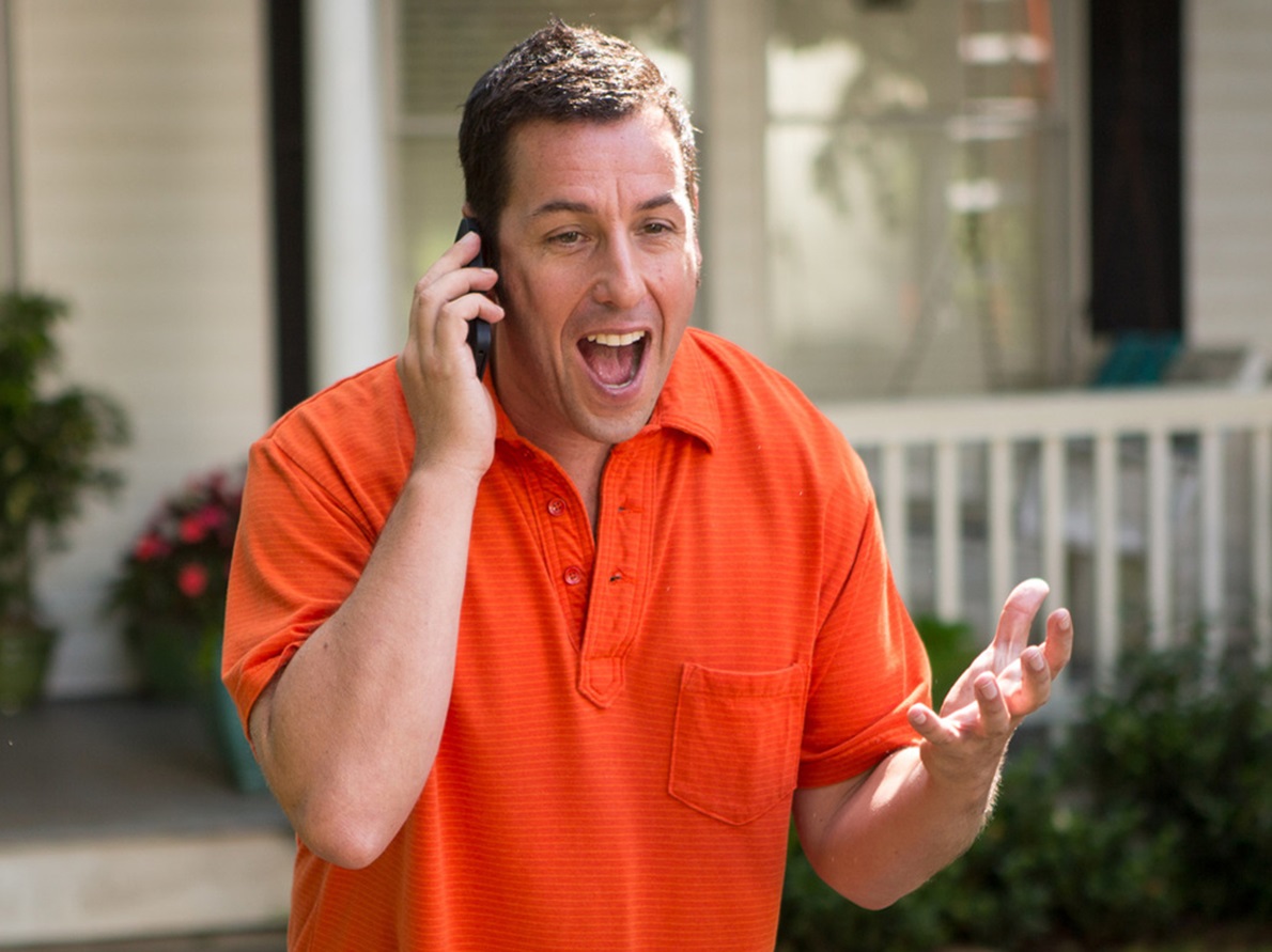 Adam Sandler talking on the phone.