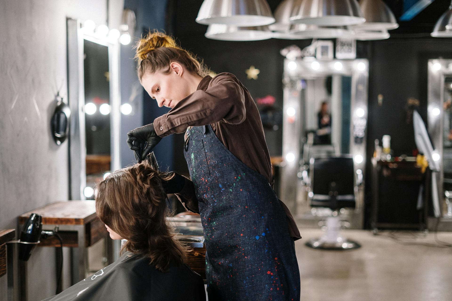 Woman Getting a Haircut in a Salon