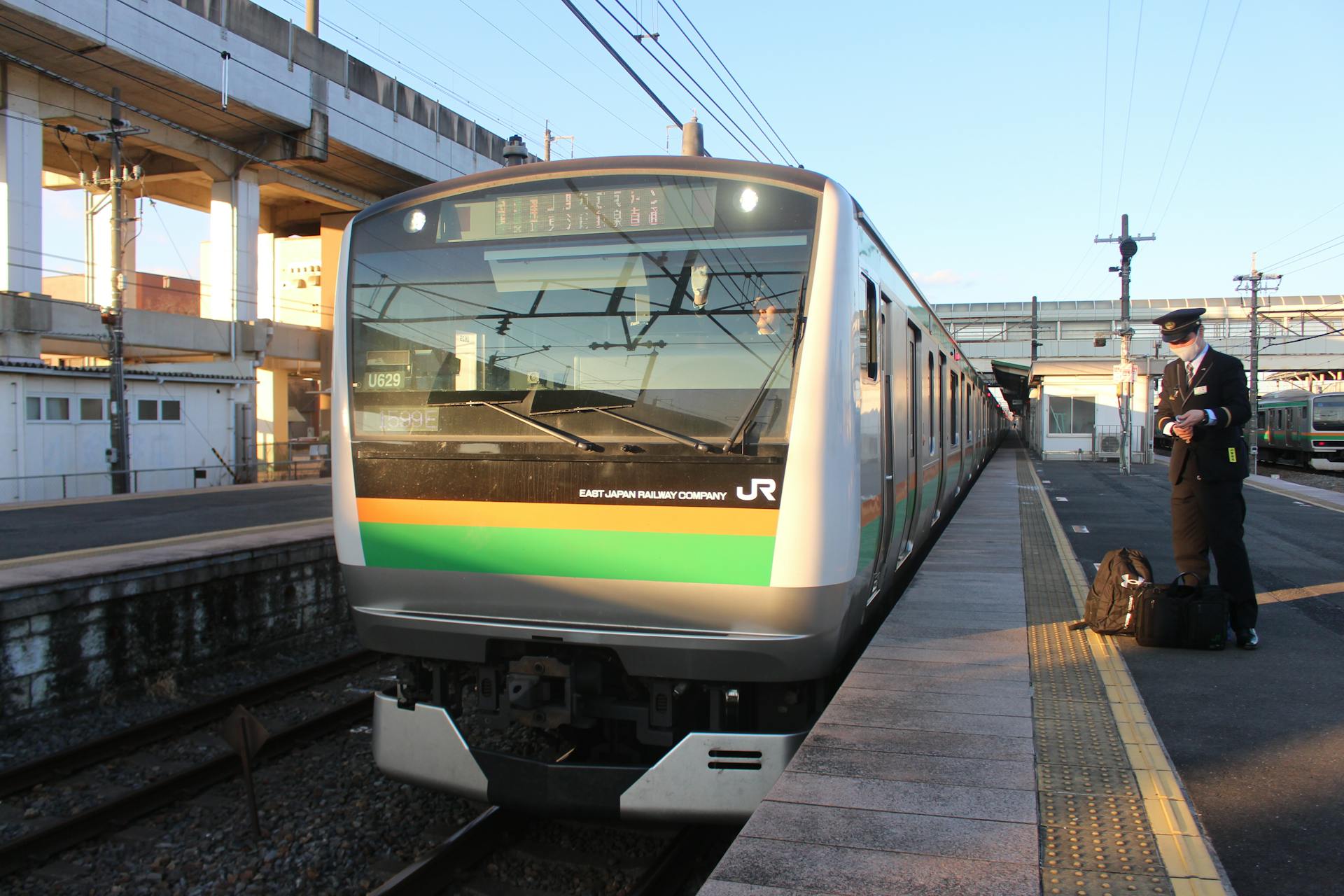 Man and Train at Railway Station