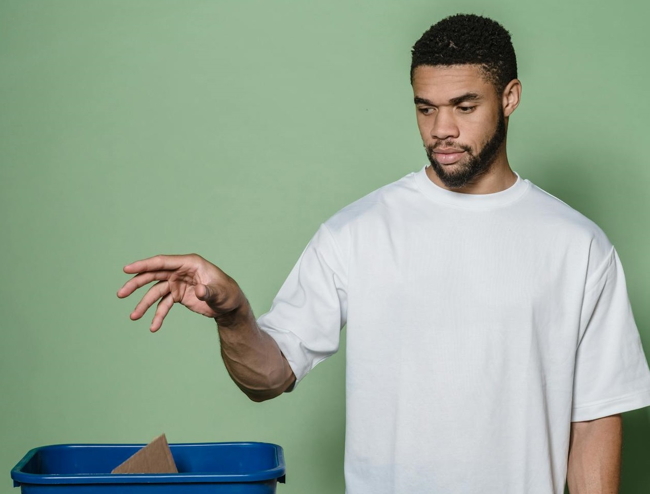 A Man Throwing a Trash
