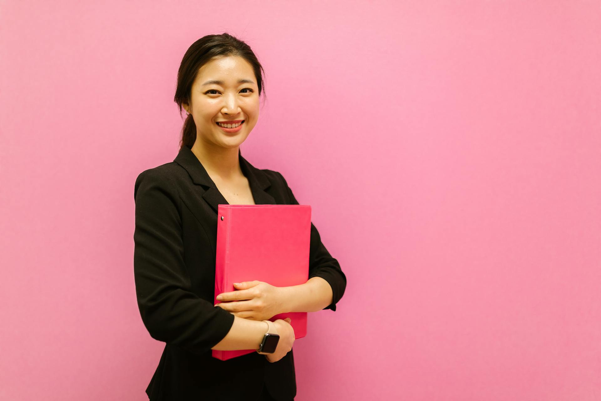 A Woman Holding a Binder